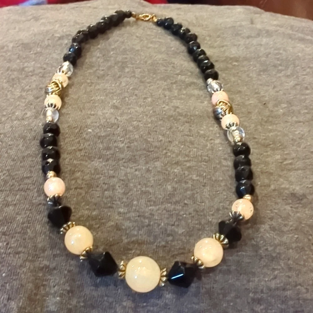 Women's black, pink‎ and clear ball necklace.
